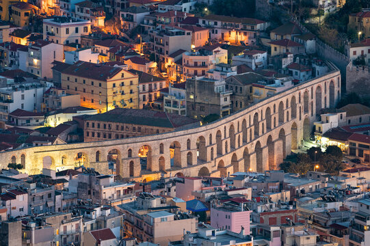 Panoramic view of the Roman aqueduct and part of the city of Kavala in eastern Greece at night