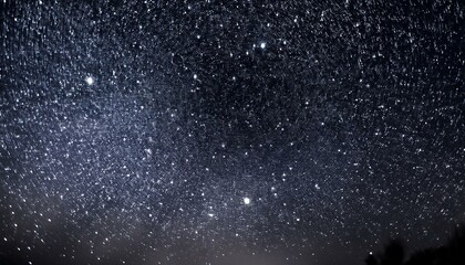 Obraz premium noise texture that resembles a starlit sky with small white dots on a darkish heritage to represent stars and larger irregular shapes to indicate distant galaxies