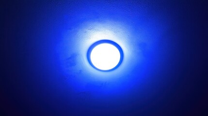 Celestial Light: A Glowing Orb Against a Deep Blue Canvas