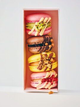 Gourmet Macarons Displayed in a Stylish Box Offering a Variety of Flavors and Colors for Indulgent Dessert Lovers