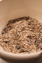 The process of preparing homemade oatmeal cookies - a mixture of dry ingredients: oatmeal, flour, dried fruit
