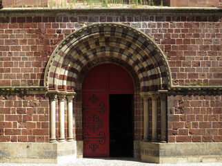 Basilica of Saint Julian. 12th century. Historic city of Brioude. France. View of the main door.