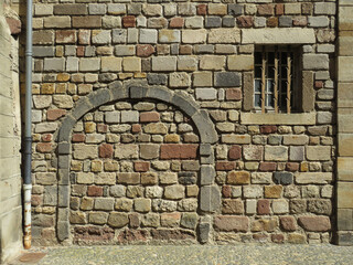 Historic house with walled up door  and window in the historic city of Brioude. Auvergne. France. 
