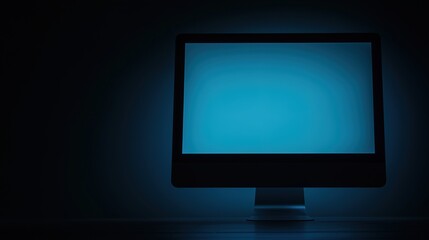 A compact computer setup glowing softly in a dark environment, symbolizing modern minimalism and focused productivity in a serene workspace.