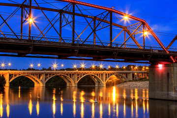 A bridge over a river with lights on it