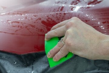 The process of installing PPF, armored film on the car. PPF is a polyurethane, protective film that...