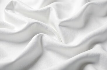 Fototapeta premium A close-up view of crumpled white fabric, showcasing intricate folds and textures. The fabric appears soft and smooth, with varying shades of white creating a dynamic visual effect