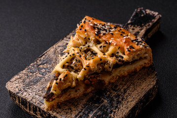 French quiche with chicken or salmon, cheese, salt, spices and herbs