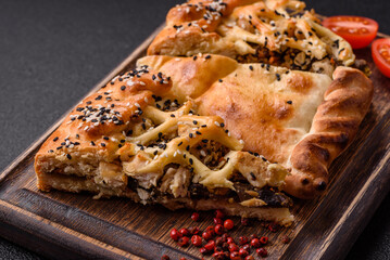 French quiche with chicken or salmon, cheese, salt, spices and herbs