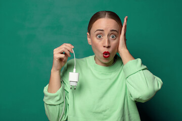young blonde woman with a smartphone charger