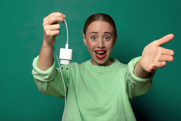 young blonde woman with a smartphone charger