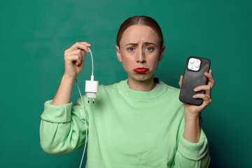 young blonde woman with a smartphone charger