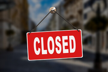 Sorry we are closed sign hanging outside a restaurant, store, office or other.