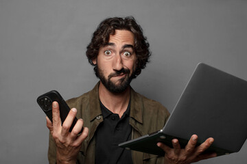 young bearded man using a laptop