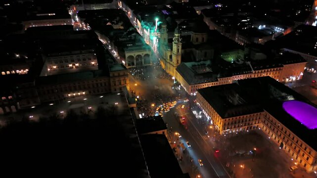 Silvester Muenchen, Deutschland, Odeonsplatz Luftaufnahme. Aerial view of Munich, Germany, showcasing vibrant New Years Eve fireworks display over city center. Stadt versinkt im Funkenregen. Salute. 