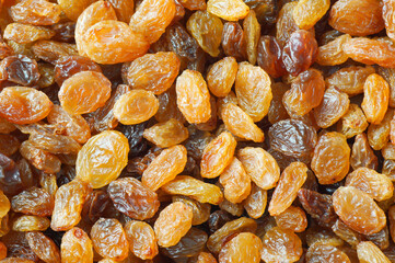 Dried grapes textured background, healthy dry fruit concept, raisins