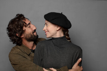 young adult couple hugging and together