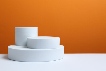 White podium on color background