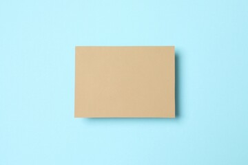 Craft paper card on color background