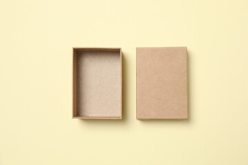 Open cardboard box on color background