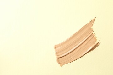 A smear of liquid foundation. Makeup base, smear of BB cream