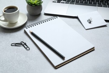 Workplace with notebook, laptop and coffee cup, top view