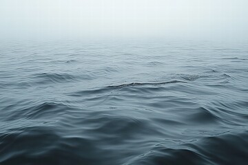 Naklejka premium Texture of rippling water on a calm lake during a misty morning