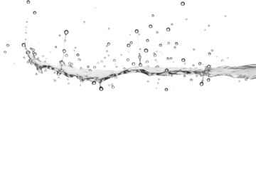 Water droplets creating abstract patterns on a white backdrop during a studio shoot