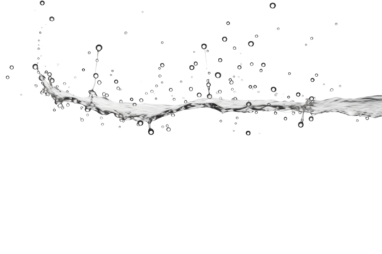 Water droplets creating abstract patterns on a white backdrop during a studio shoot