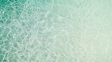 Sunlight creates mesmerizing patterns on the bottom of a pristine swimming pool, inviting guests to enjoy a refreshing dip on a perfect summer day