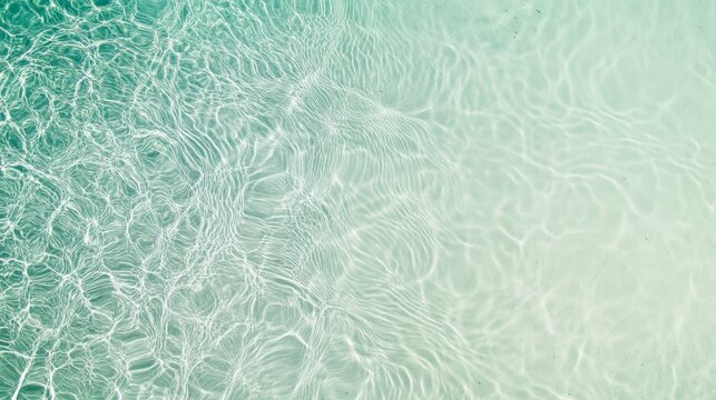 Sunlight creates mesmerizing patterns on the bottom of a pristine swimming pool, inviting guests to enjoy a refreshing dip on a perfect summer day