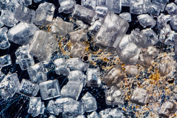 Macrophotography of white sugar crystals, substance crystals under the microscope, unhealthy sugar, sugar compounds, sweetening products.
