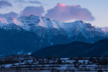 A Beautiful Winter Panorama of the Bucegi Mountains (Romania) at Sunset in Early January