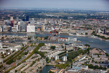 Stunning aerial view of Rotterdam showcasing skyline, river, and city layout during a clear day