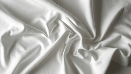 Obraz premium Top view of a wrinkled white fabric lies gracefully on a surface, showcasing its texture and gentle folds. The light reflects beautifully, highlighting the smoothness and depth of the material