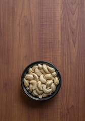 Cashews on a small black bowl