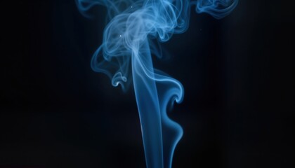 Dark blue smoke swirls against black background. Intense light highlights smoke intricate forms. Abstract design motion, color. Dramatic visual for many creative uses like storm, night sky, explosion