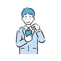 スマホを操作するスーツを着た男性