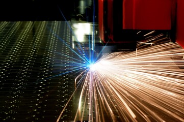 Laser cutting of metal sheet with sparks