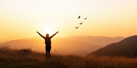 A stunning silhouette of an individual, arms outstretched against a vibrant sunset, symbolizing hope, freedom, and the sheer beauty of nature at dusk in a tranquil landscape.