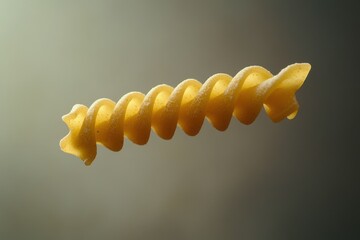 Naklejka premium A single piece of spiraled pasta floats gently