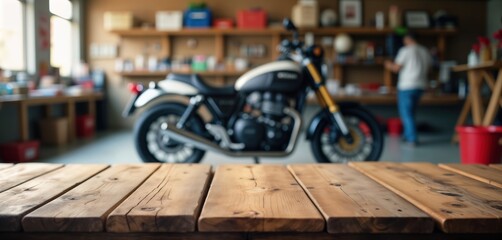 Wooden table in garage shop. Blurred motorcycle background. Empty space on table suitable for product presentation. Motorcycle parts accessories displayed on table for retail workshop photo. Garage