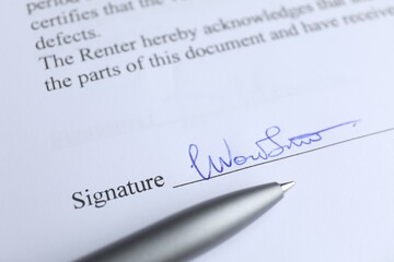 Ballpoint pen and signature on contract, closeup