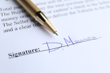 Obraz premium Ballpoint pen and signature on contract, closeup