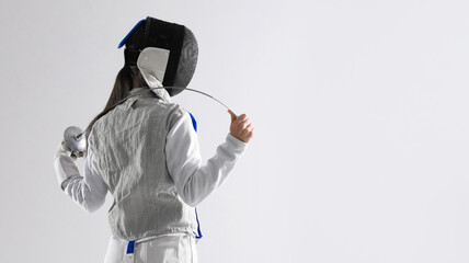 Fencer with epee on white background, space for text