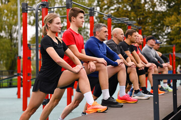 Group of people stretching in park. Healthy lifestyle