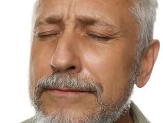 Sad senior man crying on white background, closeup
