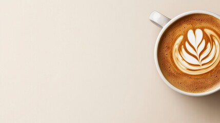   A cup of cappuccino with a leaf pattern on its foamy top
