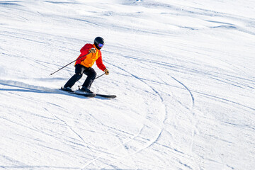 People are having fun in downhill skiing and snowboarding	