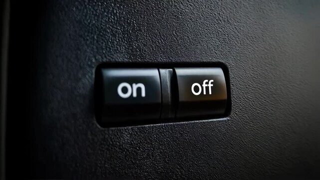 Black power switch with on to off position on dark textured wall, camera slowly moving backwards. Concept of power control, energy management, choice making